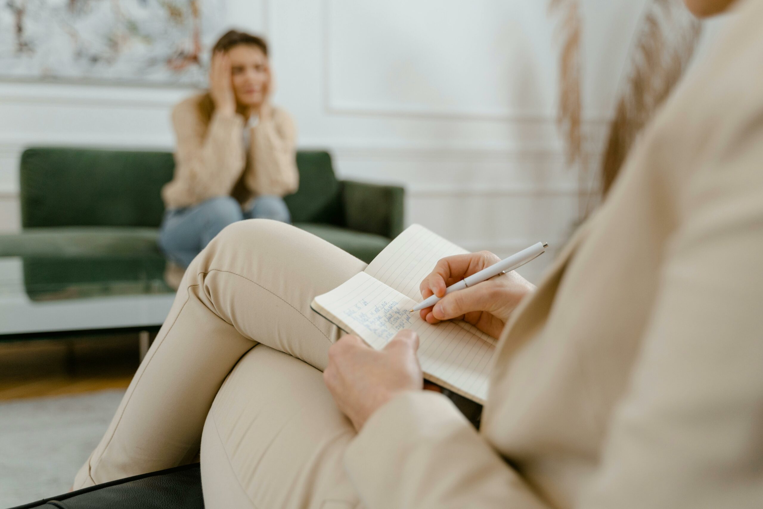 Etobicoke therapist taking notes during an in-person counselling session