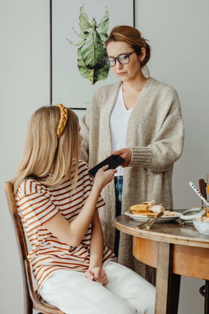 Parent setting a boundary with her child during a calm, everyday parenting moment at home